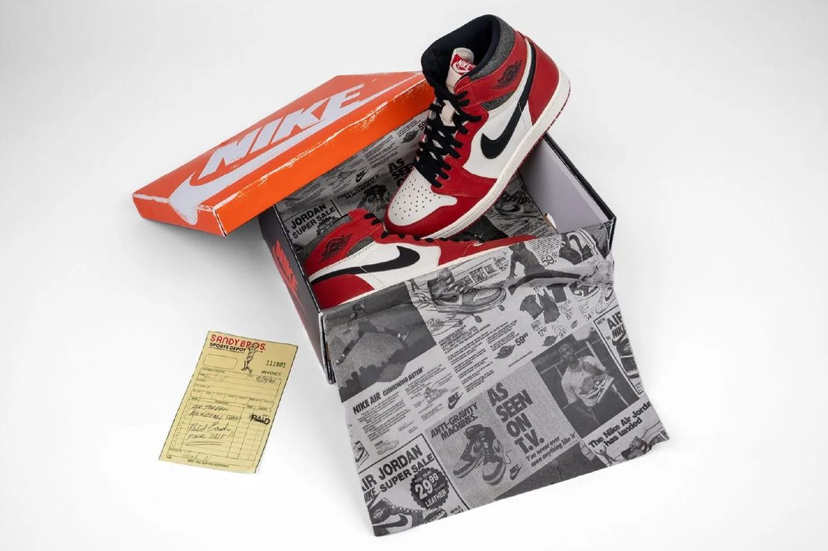 AJ1 Chicago in its box with the 1985-style newspaper tissue and receipt